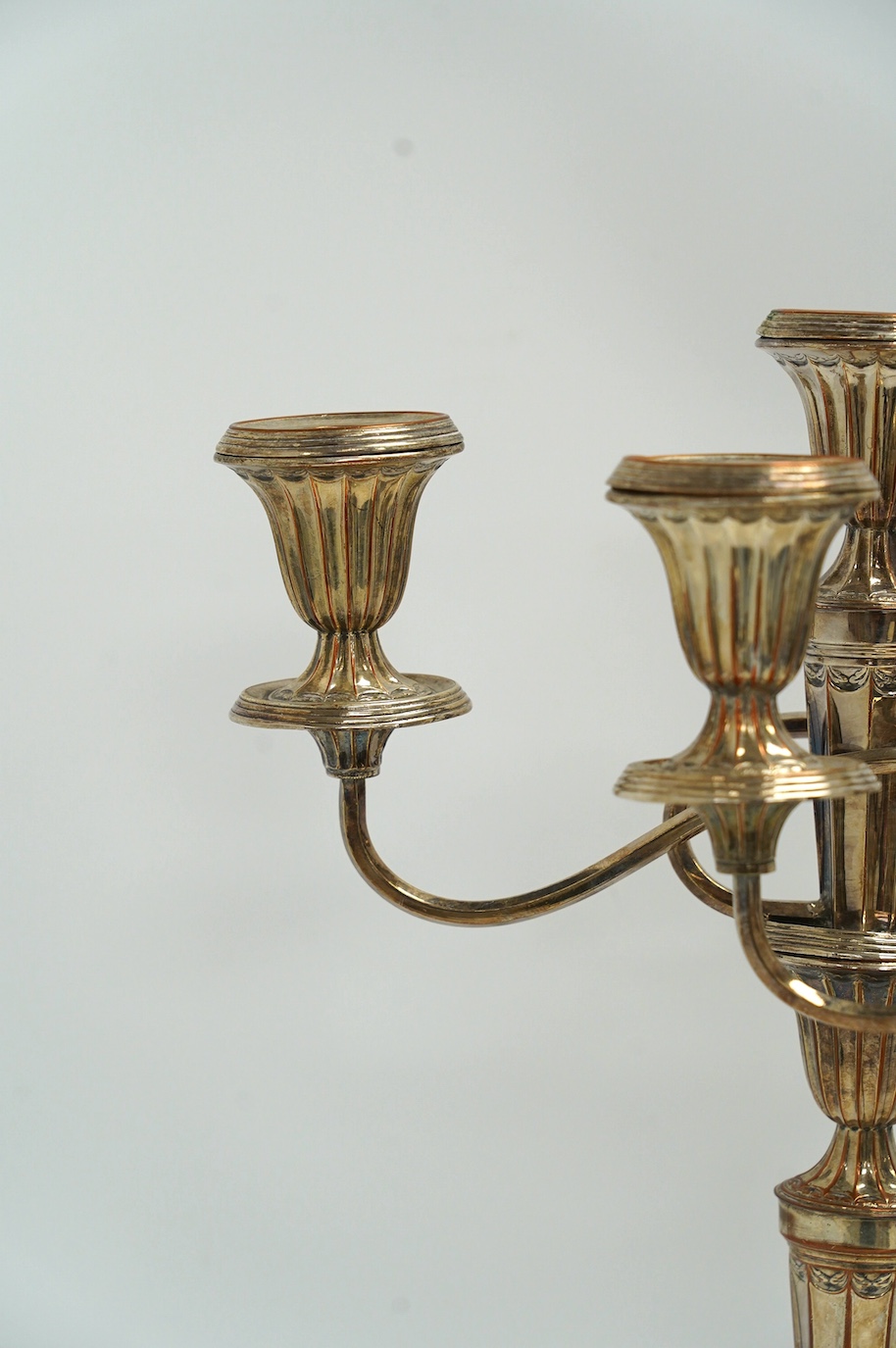 A pair of 19th century Old Sheffield plate three light, two branch candelabra, 44cm high. Condition - fair to good